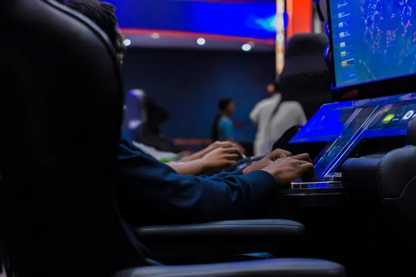 A laptop glowing with a bright login prompt in a minimalistic setup, symbolizing the protected access system at KK333.